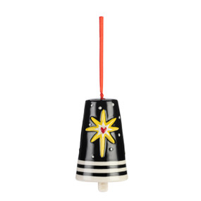 A black ceramic bell with white lines at the base and a raised yellow star on the front.