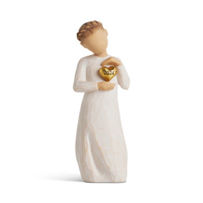 Front view: figure in cream dress holding gold-leaf heart engraved with year 2024