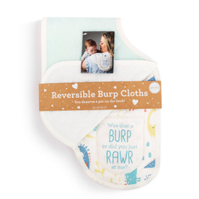 A set of two burp cloths in light green and white. One is light green and the other has illustrated dinosaurs and says "Was that a Burp or did you just Rawr at me?", displayed in a packaging band.