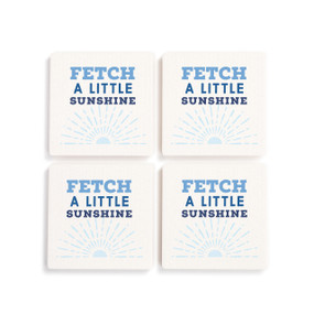 A set of four white ceramic coasters with the saying "Fetch a little sunshine".
