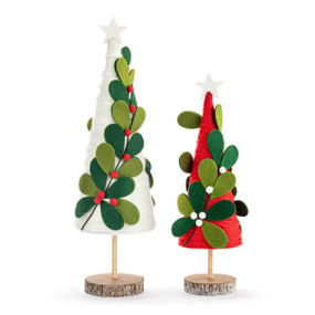 Two felt trees with green felt leaves and a white star at top. One is red and the other is white and they are on round wood bases.