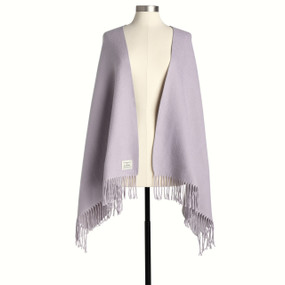 A light purple fringed wrap displayed on a mannequin.