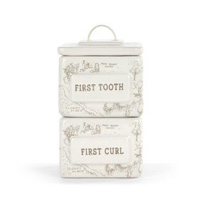 A square cream stacking ceramic first tooth and curl box with a lid and two sections. The boxes have a background of the hundred acre wood.