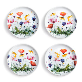 A set of 4 white ceramic appetizer plates with a watercolor image of wildflowers on them.