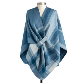 A blue plaid reversible wrap displayed on a mannequin.