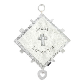 A soft white square blankie with a gray satin edge and a gray cross in the middle. The blankie says "Jesus Loves Me" and has ribbon tabs and a gray teether at the bottom.