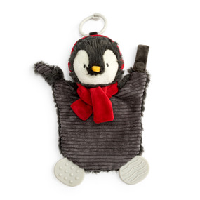 A dark gray and white penguin teether buddy wearing a red scarf and earmuffs. The teether has a stroller ring at the top.