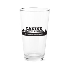 A clear pint glass with the saying "Canine canoe rental Every doggie loves to paddle."
