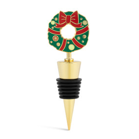 A gold and black bottle stopper with a red and green holiday wreath on top.