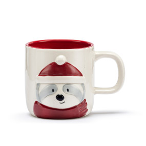 A cream ceramic mug with a red interior and the image of a white and gray sloth in a red hat and scarf on the front side.