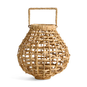 A brown open weave basket in the shape of a rounded lantern with a handle at the top.