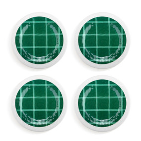 A set of four green and white plaid appetizer plates.