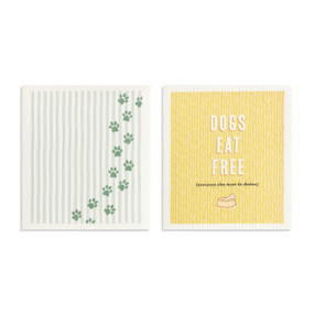 Two light green and yellow biodegradable dish cloths. One is light green and white with paw prints and the other is yellow with the saying "Dogs eat free (everyone else must do dishes)".