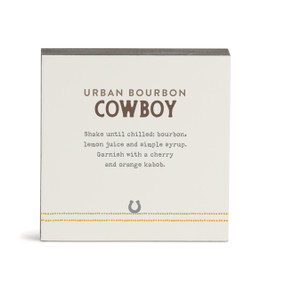 A white square wall art with a basic recipe for an Urban Bourbon Cowboy written in black.