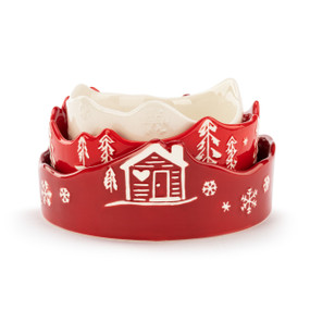 A set of three ceramic stacking bowls, each with holiday drawings. One cream small sized, one bright red medium sized, and one dark red large sized. Placed inside one another.