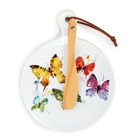 A round ceramic white mini serving board with a watercolor image of colorful butterflies. The board has a small wood knife attached.