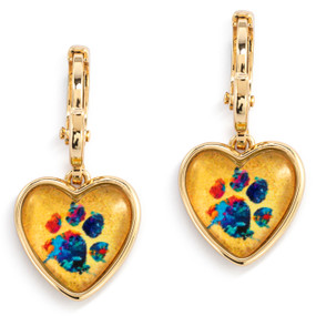 A pair of gold dangling earrings with a heart shaped charm and a colorful paw print inside.