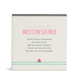 A white square wall art with a basic recipe for a Watermelon Moonshine written in pink.