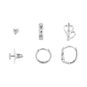 A set of three dainty silver hoop and stud heart earrings.