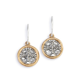 A pair of round silver metal medallion earrings with a cross on them. The earrings have a gold metal rim.