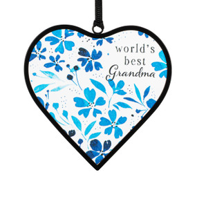 A small blue and white heart shaped sun catcher with a floral illustration and the saying "world's best Grandma".