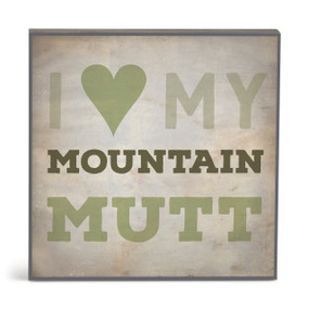A square brown wall art with the saying "I love my mountain mutt".