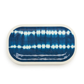 Top down view of a large white rectangular melamine platter with a blue and white tie dye pattern.
