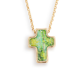 An adjustable gold chain necklace with a cross shaped charm and a green illustration.