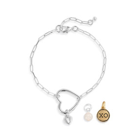 A silver chain bracelet with an open heart that is used to place other charms on.