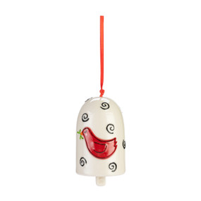 A white ceramic bell with black swirls and a raised red cardinal on the front.