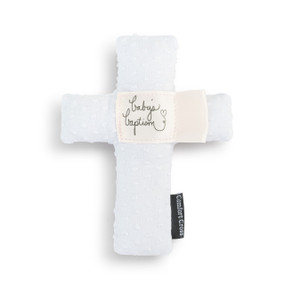 A white plush cross with the saying "baby's baptism" in the middle.