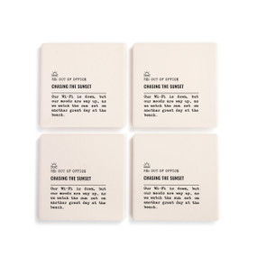 A set of four white ceramic coasters with the saying "RE: Out of Office Chasing the Sunset" with a short write up about someone at the beach.