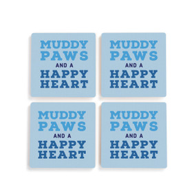A set of four blue ceramic coasters with the saying "Muddy paws and a happy heart".
