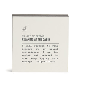 A white square wall art with the saying "RE: Out of Office Relaxing at the Cabin" with a short write up about someone at the cabin.