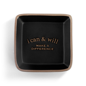 A square black ceramic trinket dish with a tan textured rim that says "i can & will Make A Difference" on the inside.