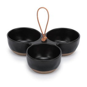 A black ceramic tri-bowl with brown textured bases and a handle in the middle.