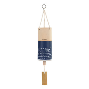 A tan and blue tubular ceramic wind chime with a wood chime. There are white dashes in the bottom blue half and the top says "blessed".