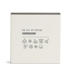 A white square wall art with the saying "RE: Out of Office Snowbound!" with a set of emoji images related to a winter vacation.