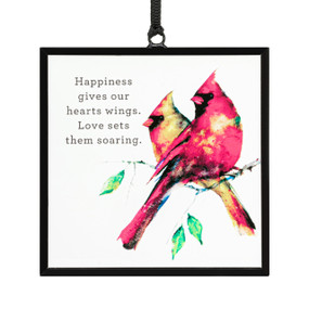 A square suncatcher with a pair of watercolor cardinals and the saying "Happiness gives our hearts wings. Love sets them soaring".