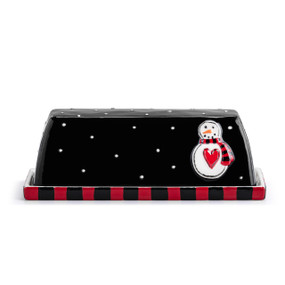 A black ceramic butter dish with a white snowman and white polka dots.