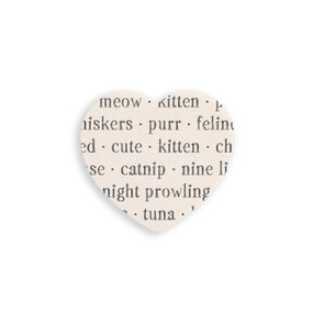 A set of four heart shaped white ceramic coasters with words about cats on it.