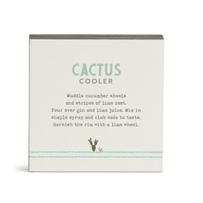 A white square wall art with a basic recipe for a Cactus Cooler written in green.