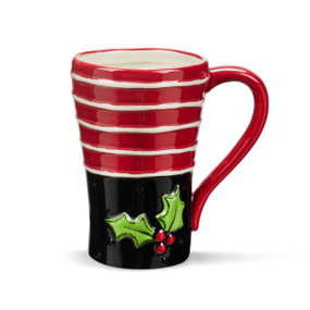 A red and white striped ceramic mug with black on the bottom half. There are holly leaves and berries on the front.