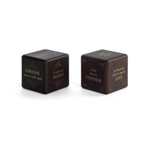 Two dark wood blocks with different blessings written in gold on each side.