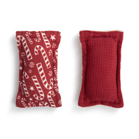 Set of two fabric holiday kitchen sponges. One has a red and white image of candy canes and the other is dark red.
