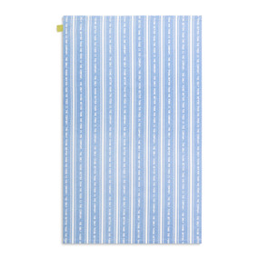 A blue and white striped kitchen towel with a saying on it displayed with the towel laid out flat.