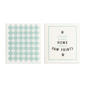Two teal and white biodegradable dish cloths. One has a teal and white plaid pattern and the other is white with the saying "a house is not a home without paw prints".
