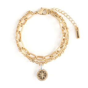 An adjustable double gold chain bracelet with a round gold metal compass medallion with a silver metal rim.