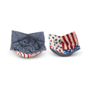 Two fabric bowl holders in a patriotic Stars and Stripes fabric on one side and a denim blue fabric on the other, sitting next to each other.