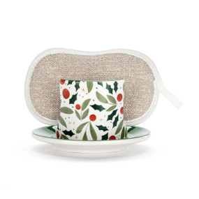 A white ceramic soap dish with a holly and berry illustration on the front, with a tan sponge in the open slot.